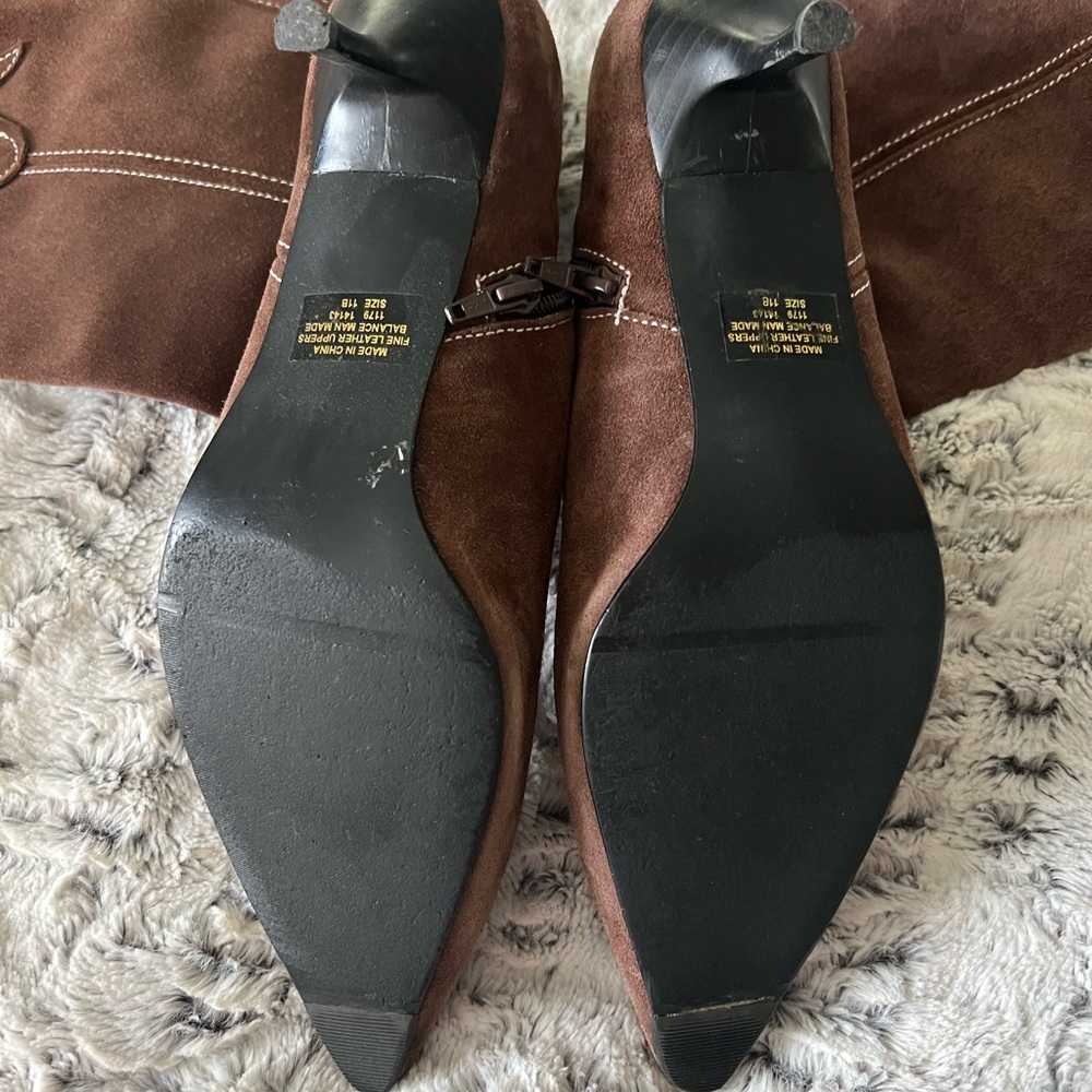 Brown suede western style boots with kitten heel.